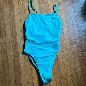 Jolyn one piece teal blue color in a size 30 there is no damage or tears in it.